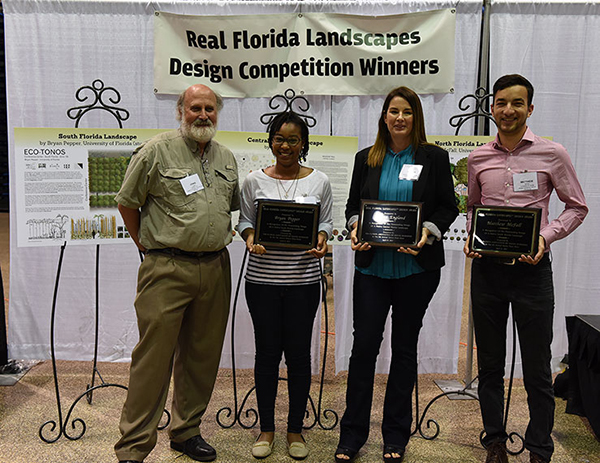 Craig Huegel with 2017 Real Florida Landscapes Design Competition award winners, from L-R: Ivy Henderson accepting on behalf of Bryan Pepper, Andrea England and Matthew McFall. 