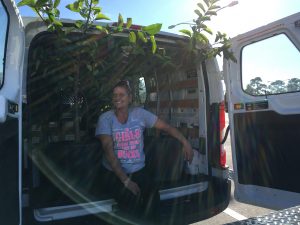 Angie Patchunka, Martin County Farms, rides along in the Uhaul to make sure our Pond Apples don't disappear.