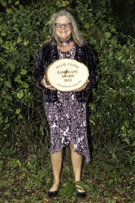 Jill Ziebell, Find Your Inner Dirt, with the Beverly Fleming Landscaping Award presented to St. Francis Inn, St. Augustine. Photo by Kay Wells.