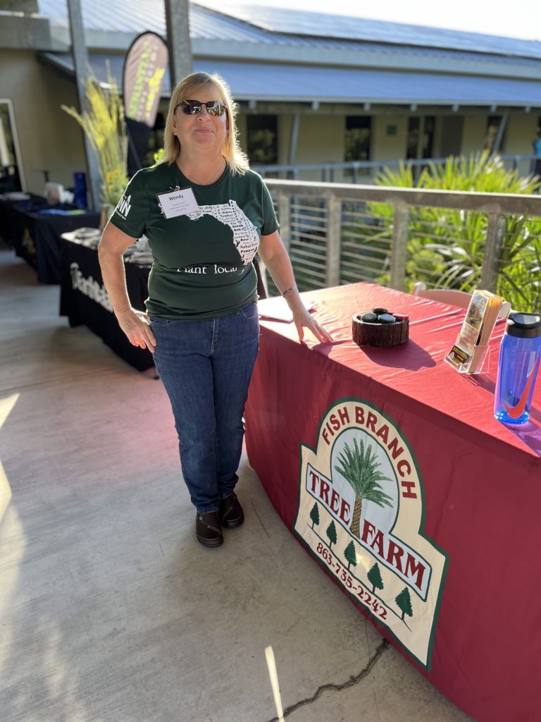 Wendy Hunter with Fish Branch Tree Farm (SOFLNP seminar sponsor), sports her new FANN Plant Local t-shirt. Wendy took "pages of notes" throughout the event.